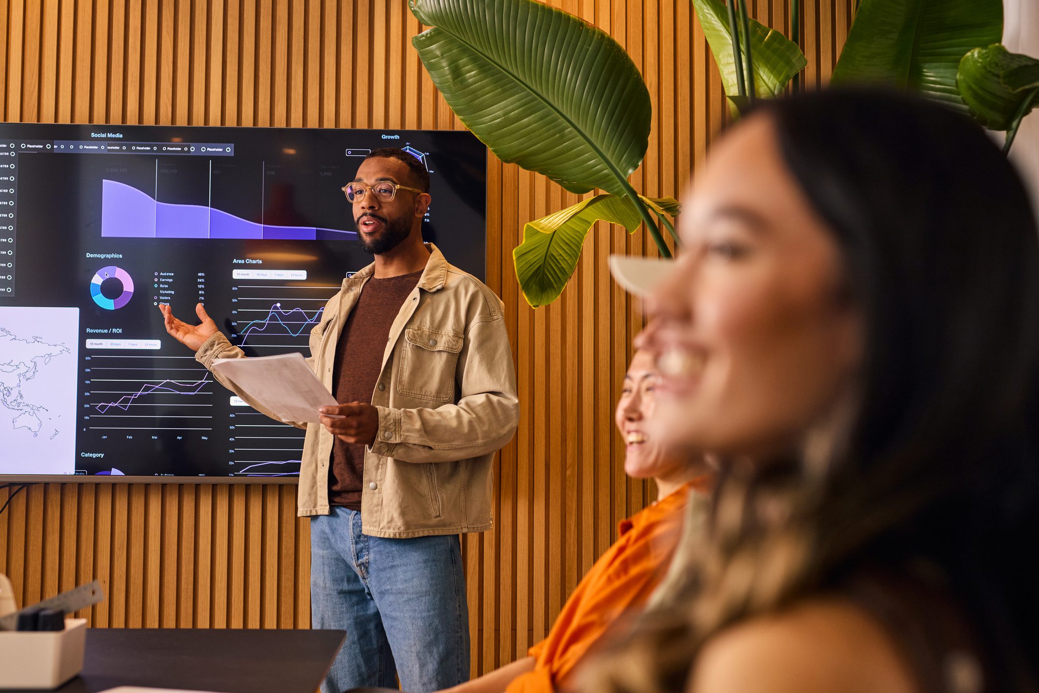 Man presenting data in a modern office.