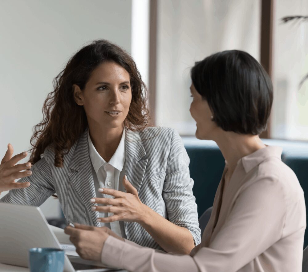 Two women having a professional discussion.