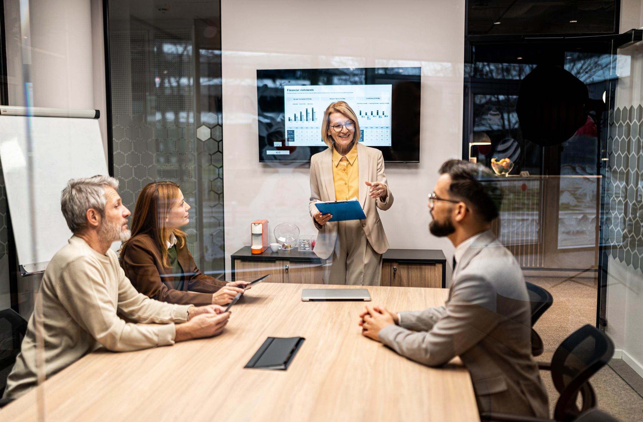 Business meeting with presentation in conference room.